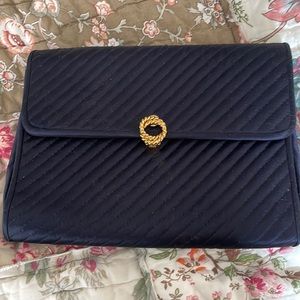 Evening clutch that has a silk rope shoulder strap as well
